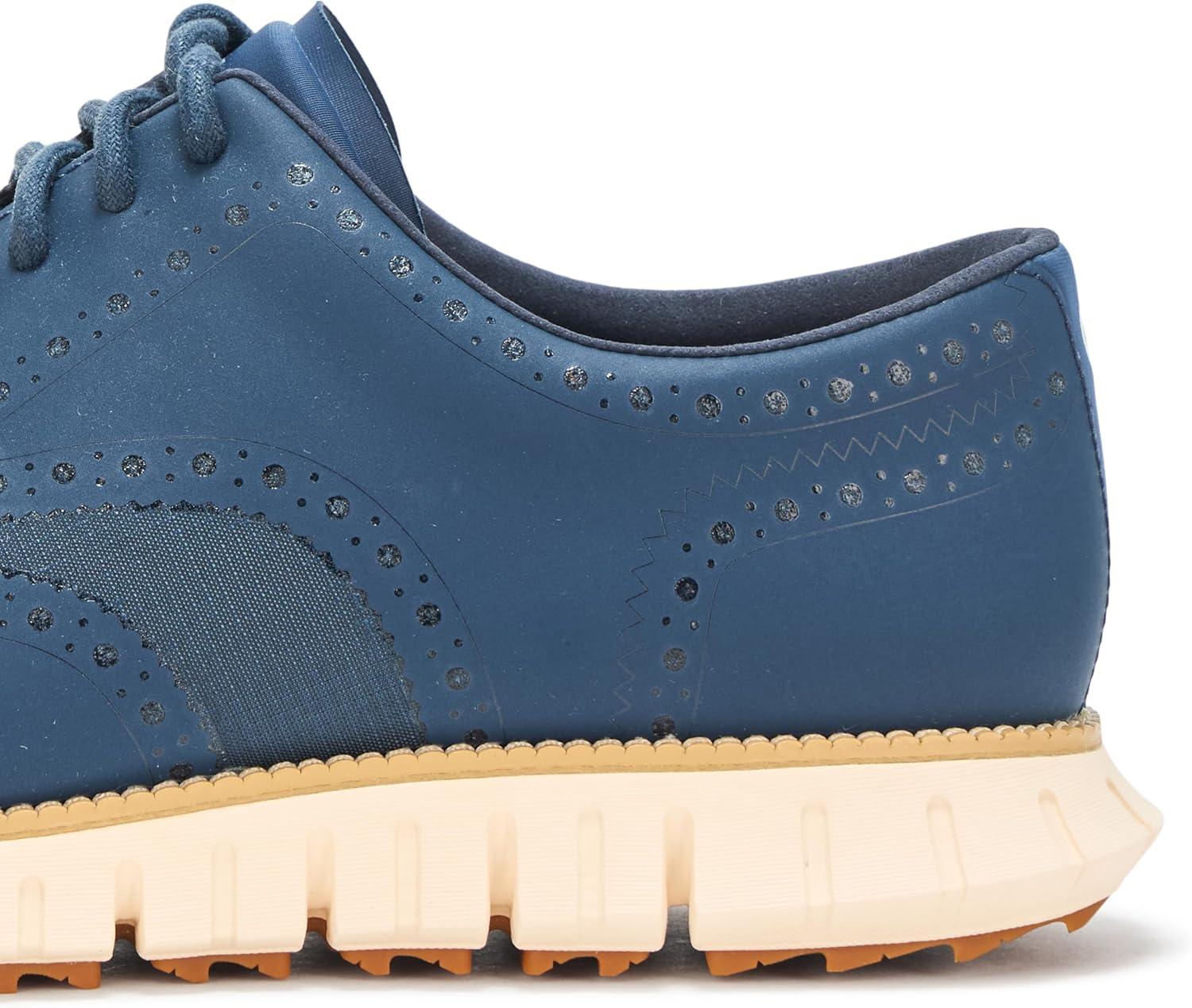 imageCole Haan Mens Zerogrand Remastered No Sew Wingtip Golf SneakerBig DipperIvory