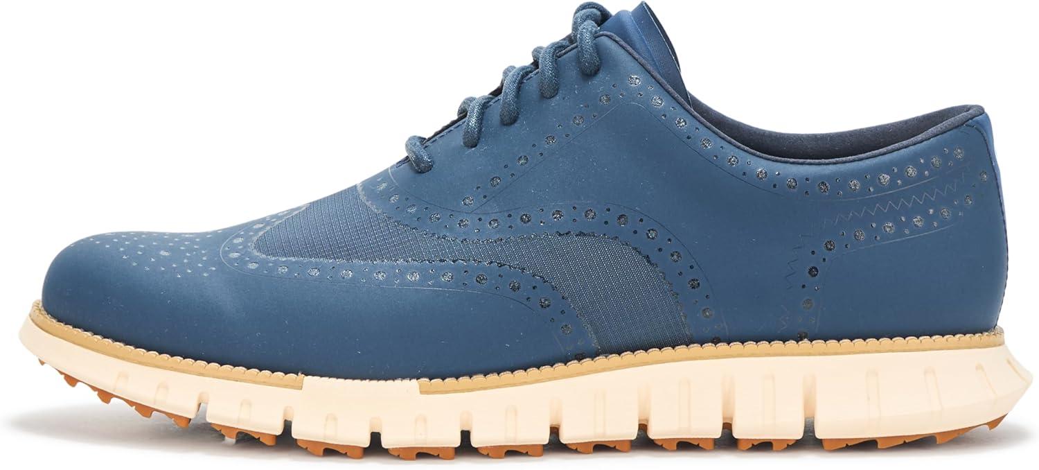 imageCole Haan Mens Zerogrand Remastered No Sew Wingtip Golf SneakerBig DipperIvory