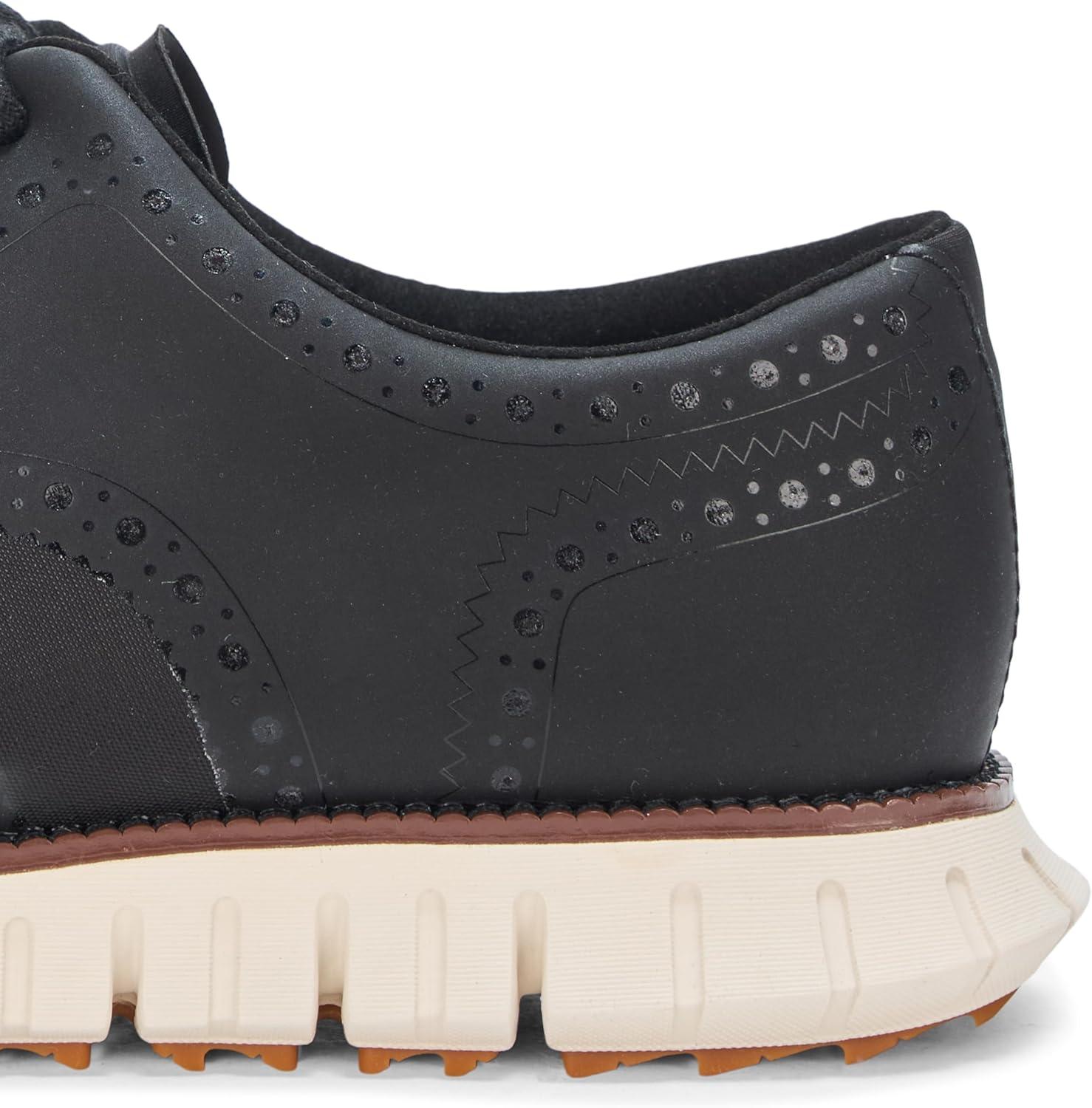 imageCole Haan Mens Zerogrand Remastered No Sew Wingtip Golf SneakerBlackNimbus Cld