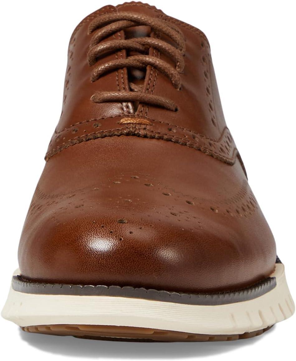 imageCole Haan Mens Zerogrand Remastered Wingtip OxfordsBritish TanIvory