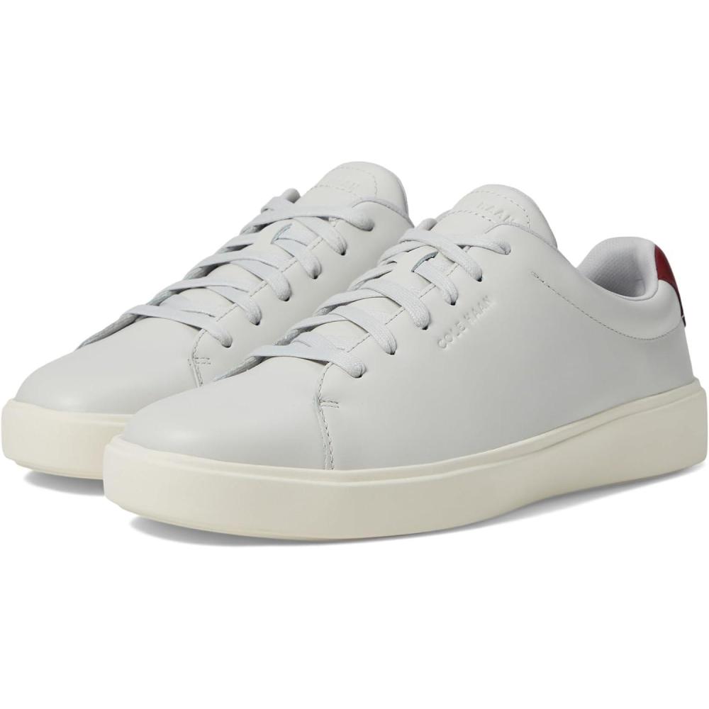 imageCole Haan Mens Grand Crosscourt Traveler SneakerGlacier GrayCarbernetIvory