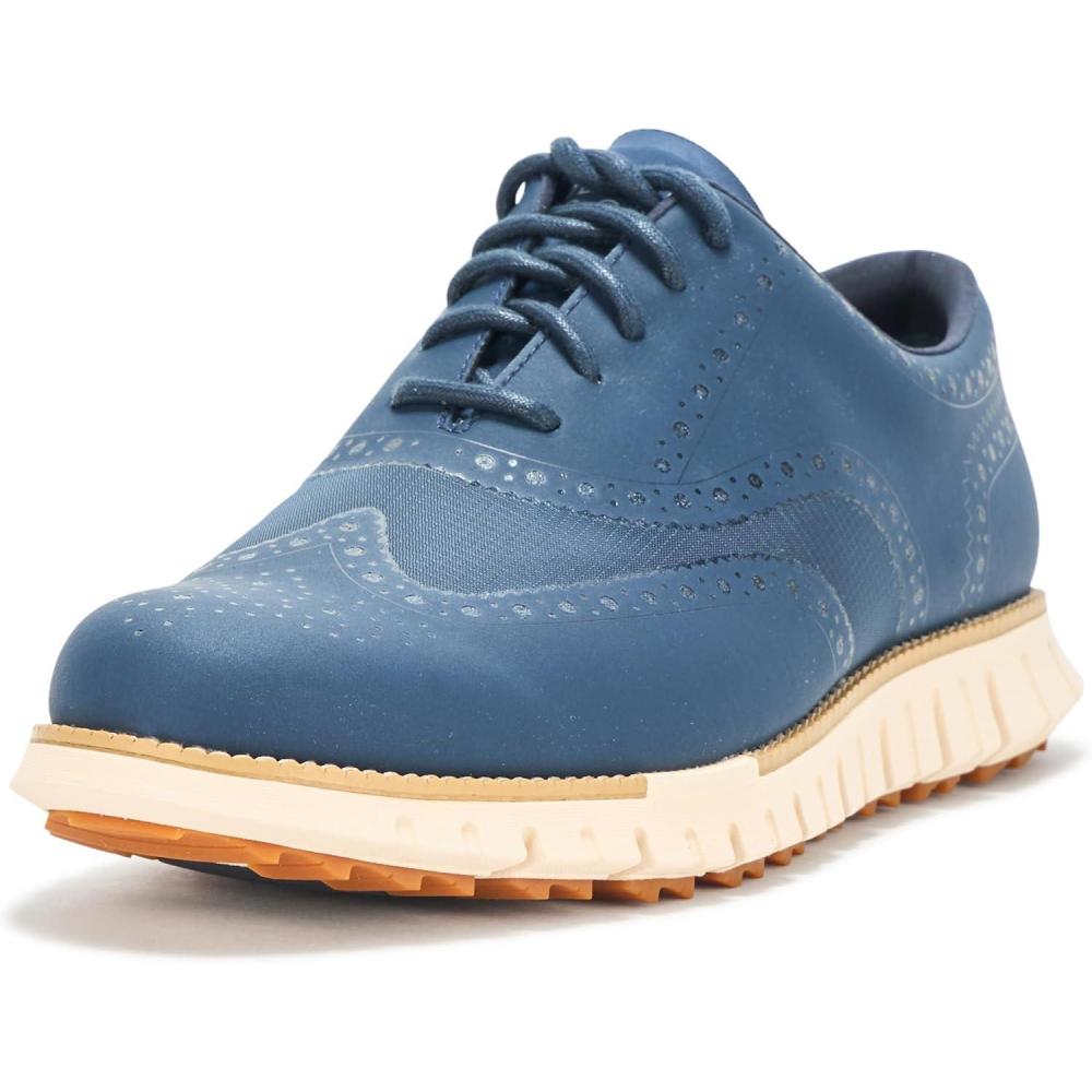 imageCole Haan Mens Zerogrand Remastered No Sew Wingtip Golf SneakerBig DipperIvory