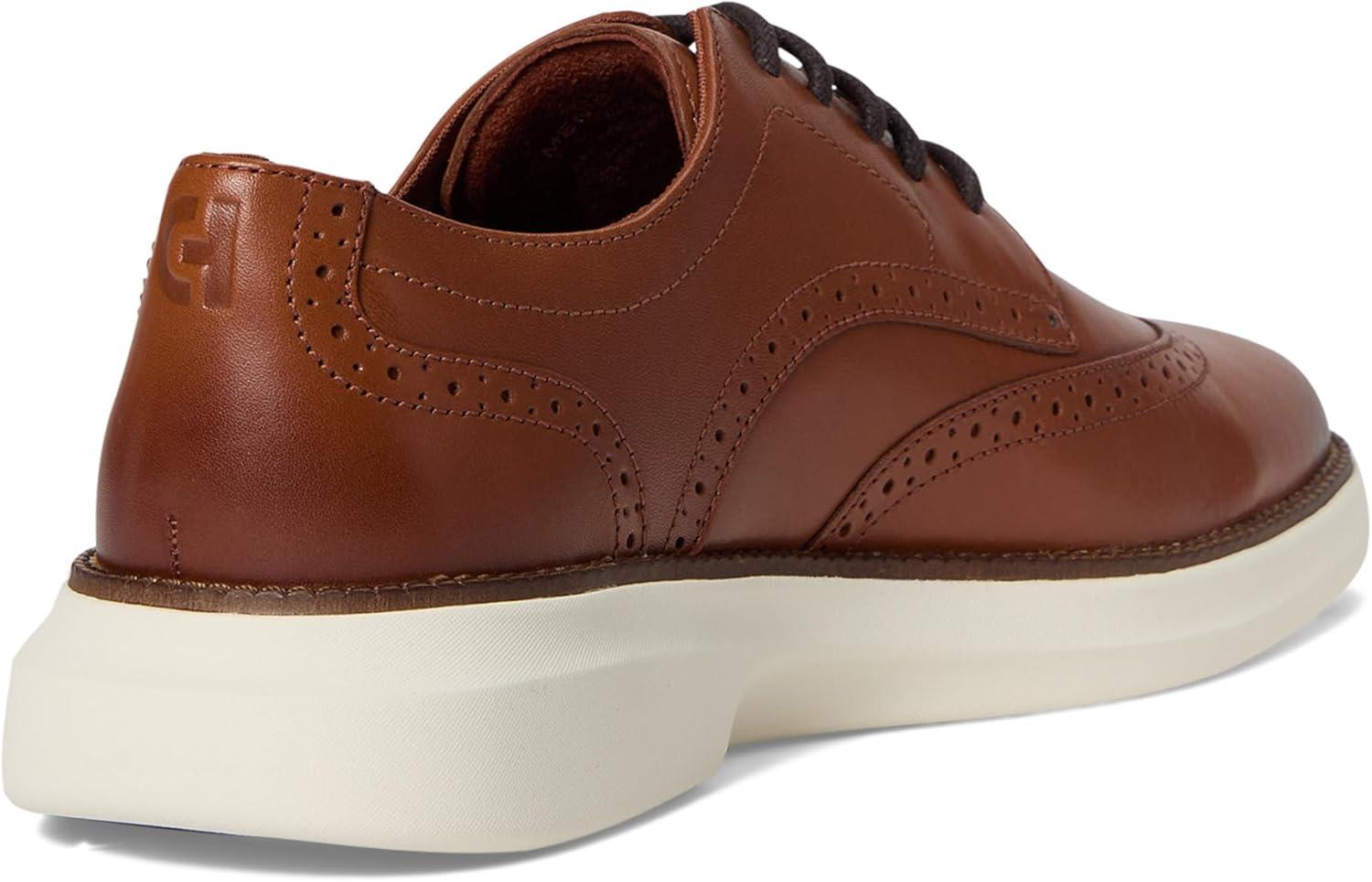imageCole Haan Mens Grand Shadowlite WingtipBritish TanIvory