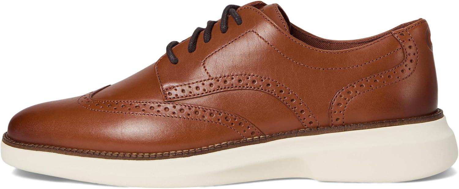 imageCole Haan Mens Grand Shadowlite WingtipBritish TanIvory