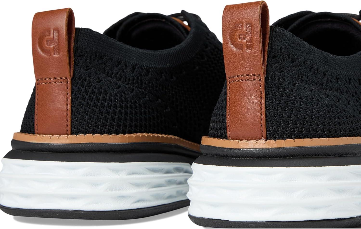 imageCole Haan Mens Grand Hurrion Stitchlite WingtipBlackCh British TanBlack