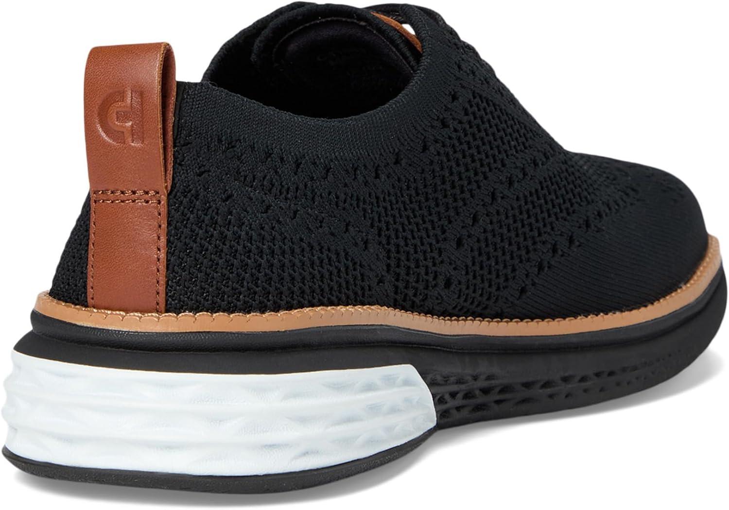 imageCole Haan Mens Grand Hurrion Stitchlite WingtipBlackCh British TanBlack