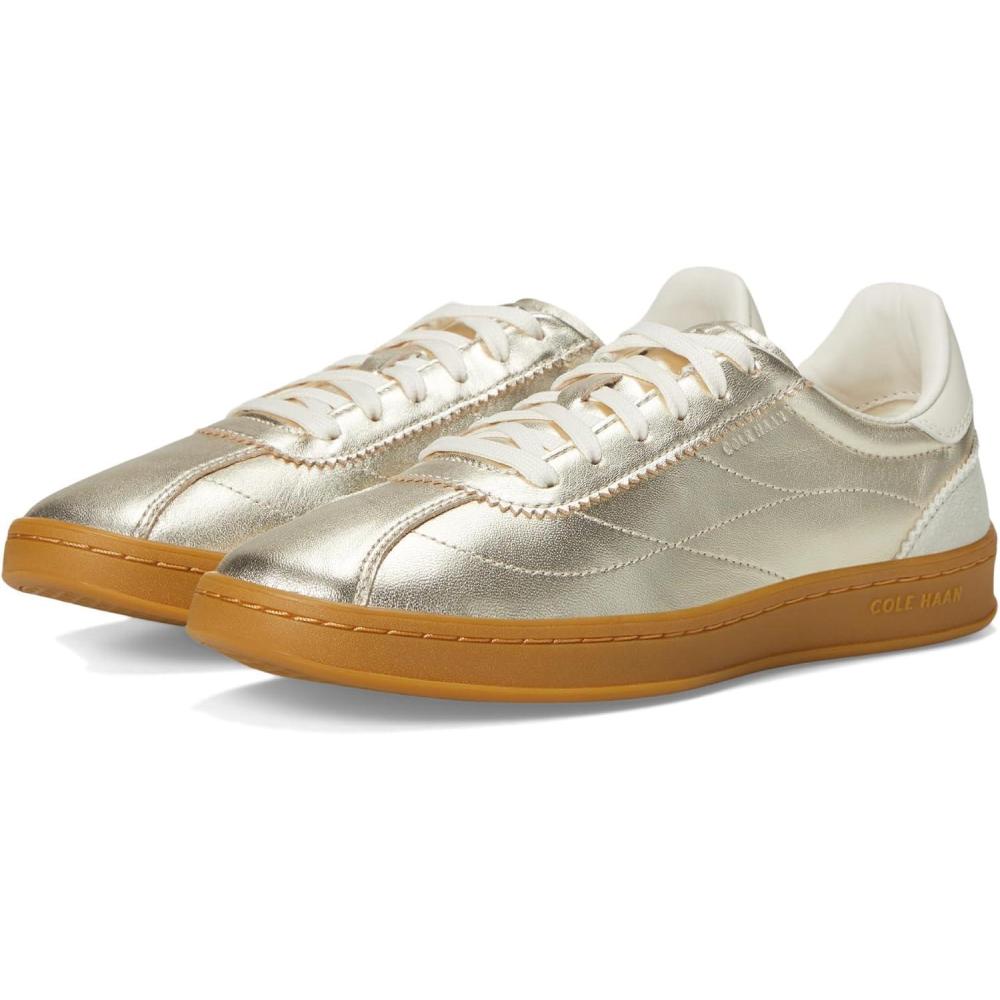 image:imageCole Haan Womens Grand Crosscourt Brynn SneakerSoft Gold MetallicSilver Birch SuedeIvoryGum